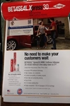 Picture of Able Auto Glass in Houston, TX  business card over a flyer of Dupont Xpress30 that 
    has a 30-minute Safe-Drive-Away-Time after the glass is set onto the body.