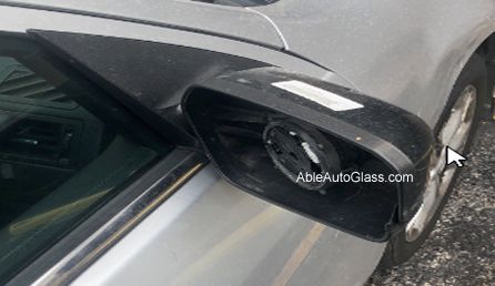 Someone nicked the back cover and glass mirror of the passenger door glass mirror.  
The client was new to Houston, TX from Michigan, and stayed at a hotel when somebody stole the mirror parts. The car is silver, and the mirror is black that had a silver backing.